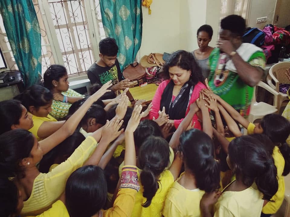 Children smiling together at a community gathering
